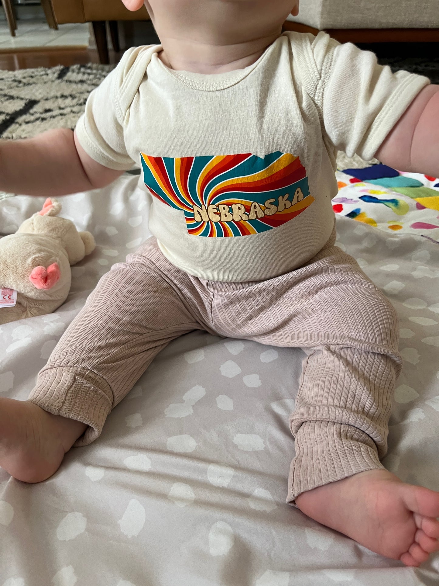 Groovy Nebraska Baby Onesie